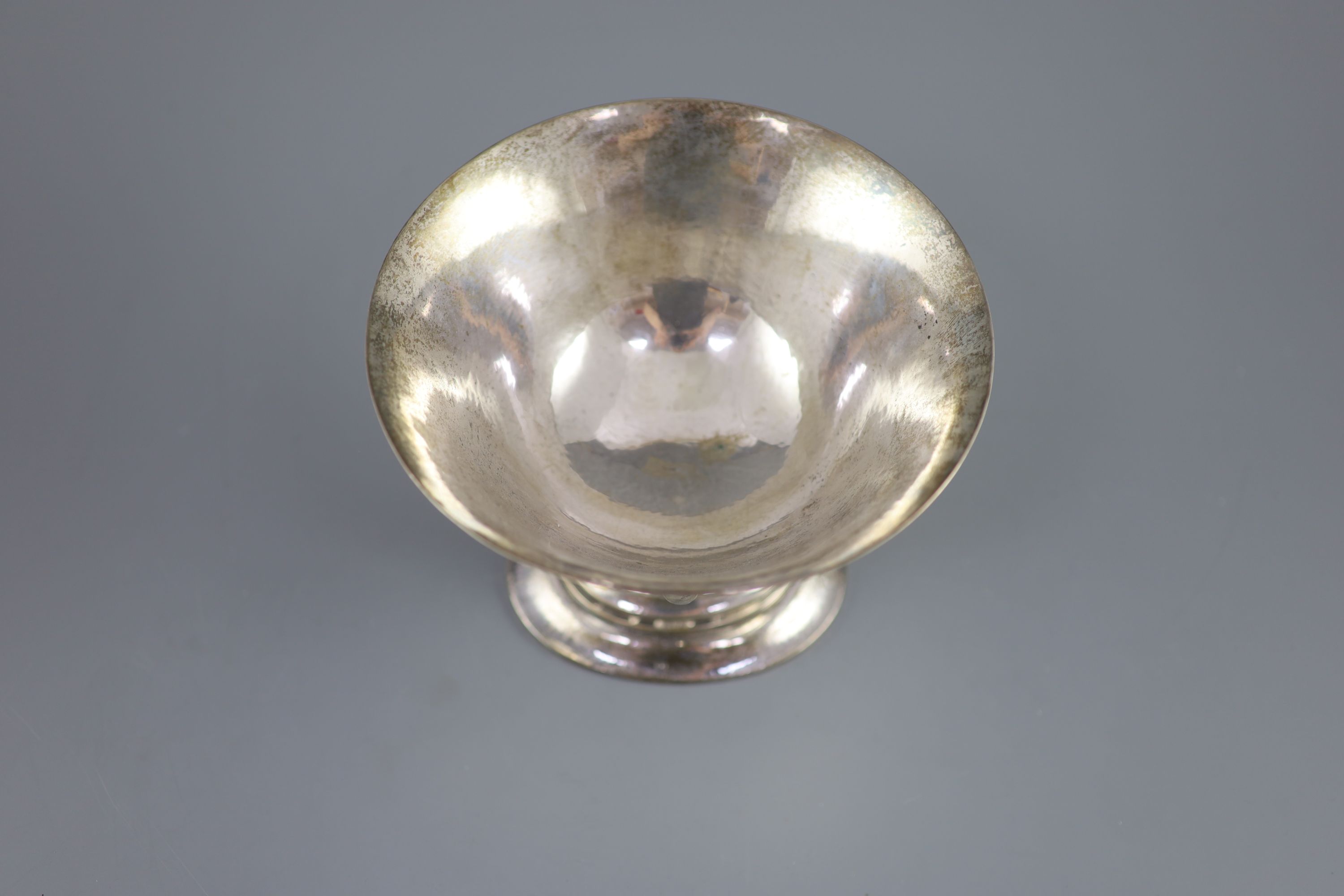 An early 20th century Georg Jensen planished sterling silver circular pedestal bowl